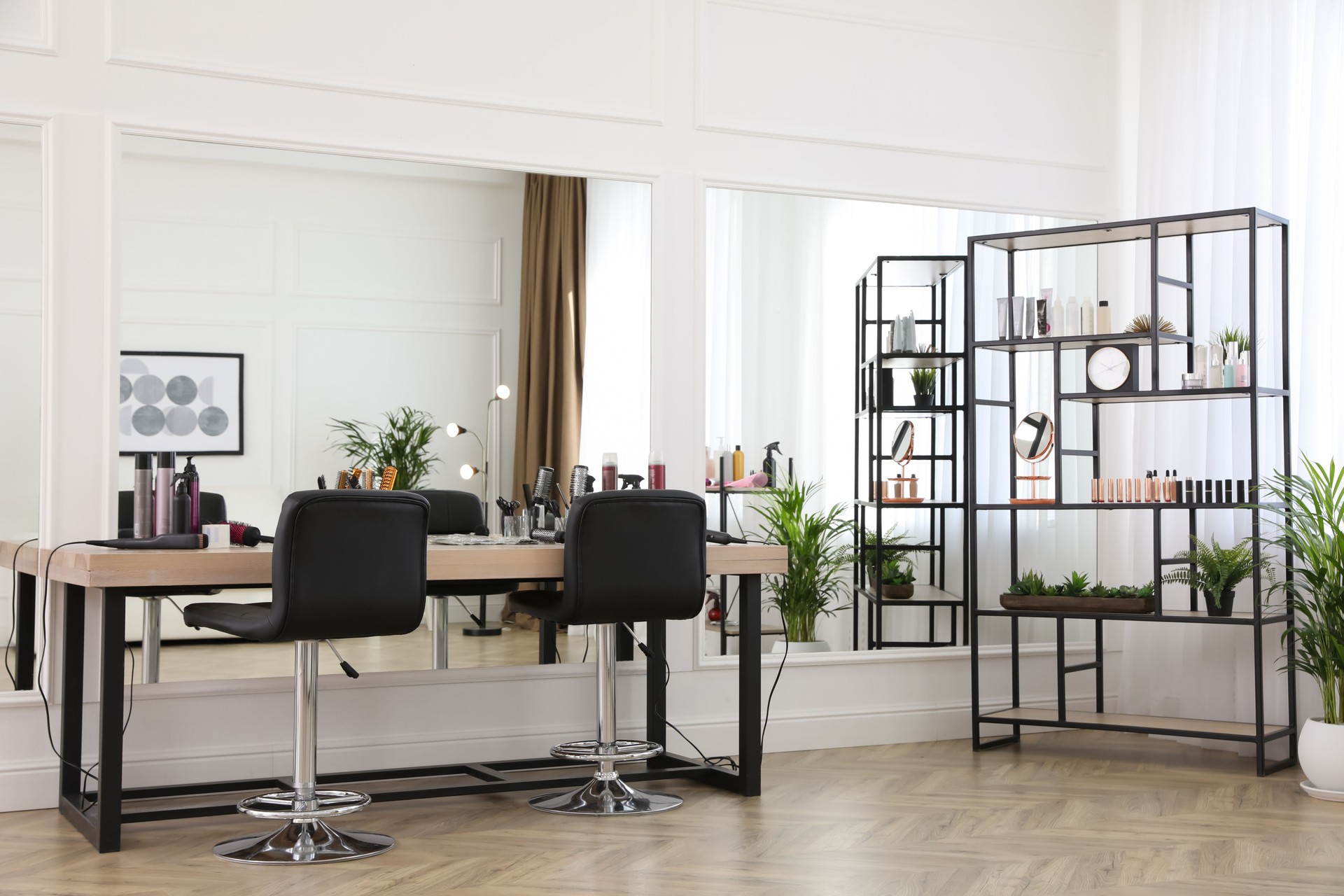 Stylish beauty salon interior with hairdresser's workplace