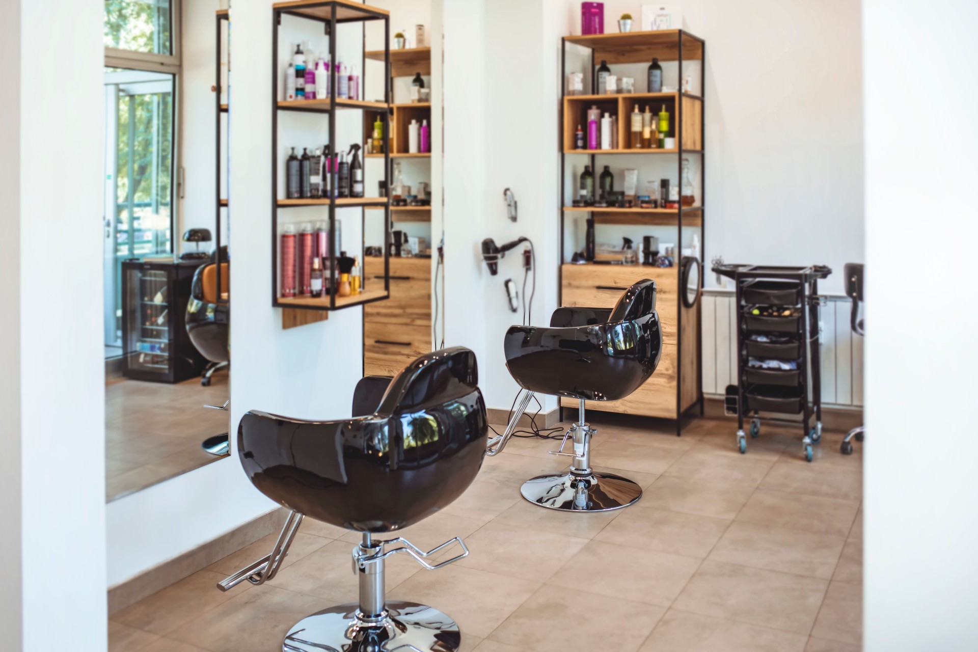 Interior of empty modern hair and beauty salon decorated in wooden colors